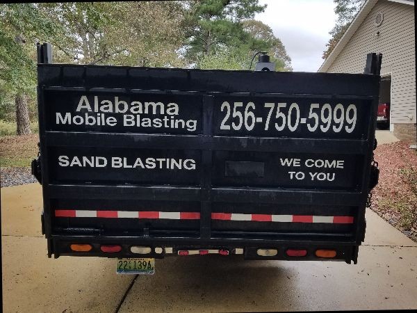 Sandblasting truck.